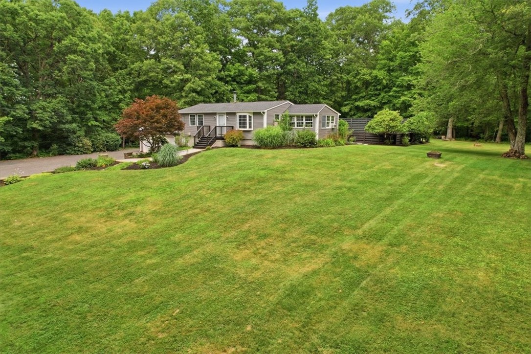 214 Anan Wade Road Glocester, RI 02857 - Photo 48 of 50 The broad, level lawn provides tremendous flexibility for outdoor games, pets, play space, gardening, gatherings, sports, or simply enjoying the open space and privacy. Mature trees add shade and character while the surrounding woods create a quiet, natural setting that feels worlds away from the everyday.