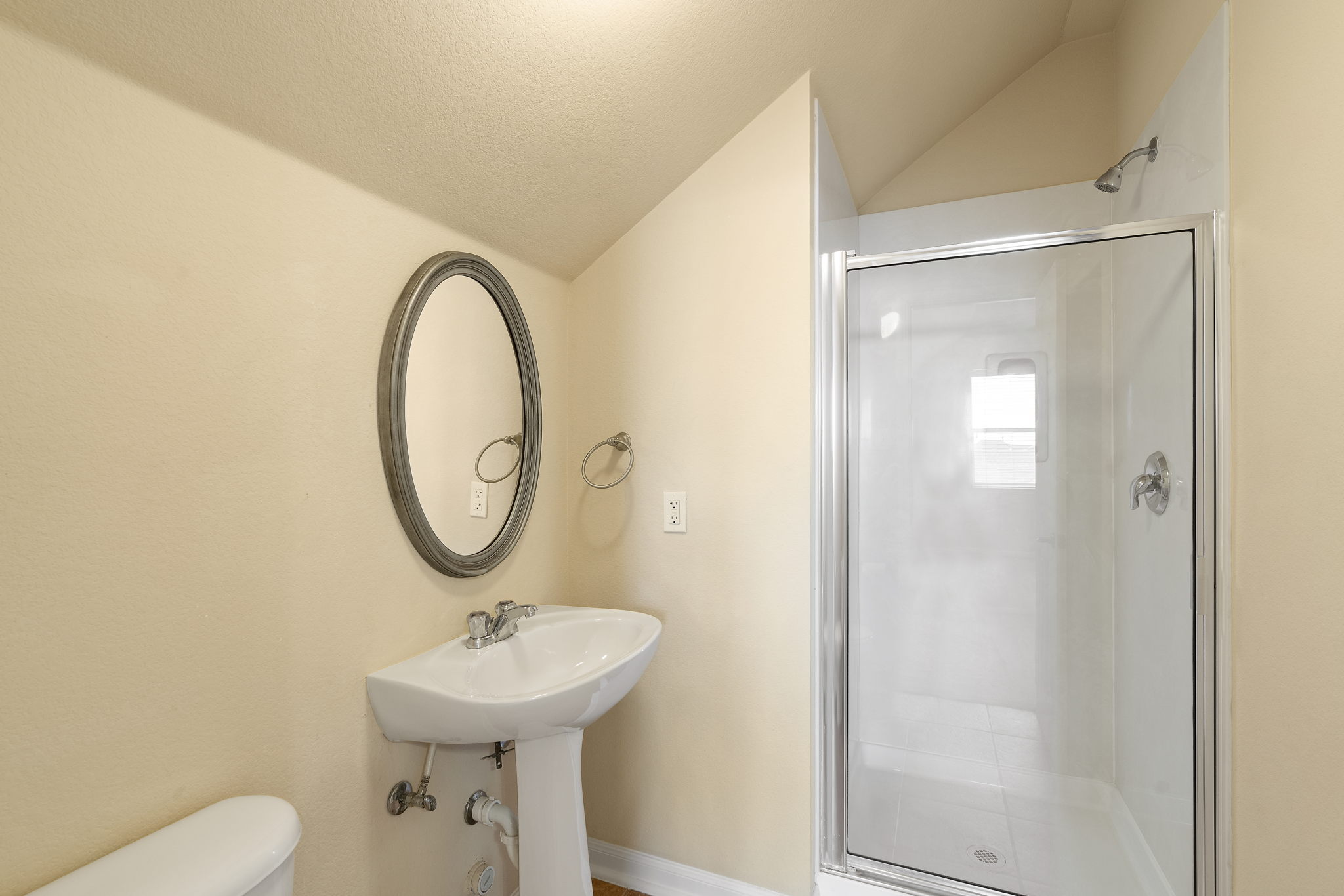 3501 Shellcastle Lane Round Rock, TX 78681 - Photo 18 of 19 a bathroom with a sink a toilet and a mirror