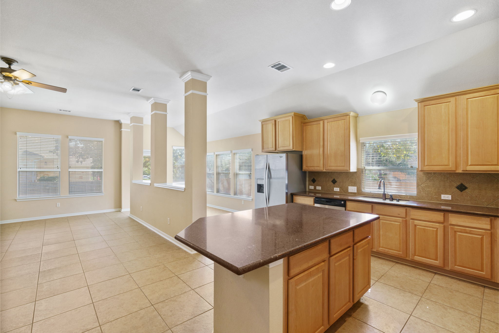 3501 Shellcastle Lane Round Rock, TX 78681 - Photo 8 of 19 a kitchen with a stove a sink and a refrigerator