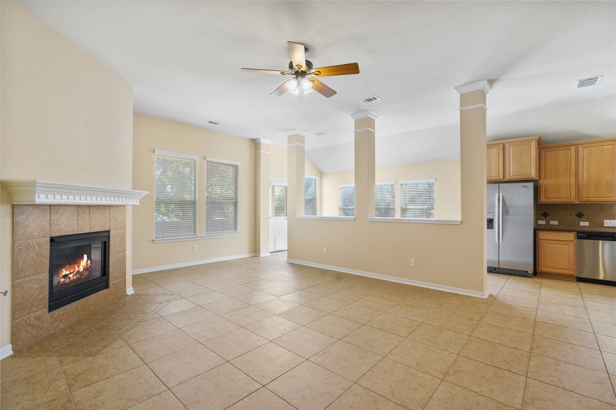 3501 Shellcastle Lane Round Rock, TX 78681 - Photo 9 of 19 a view of an empty room with a fireplace and a window