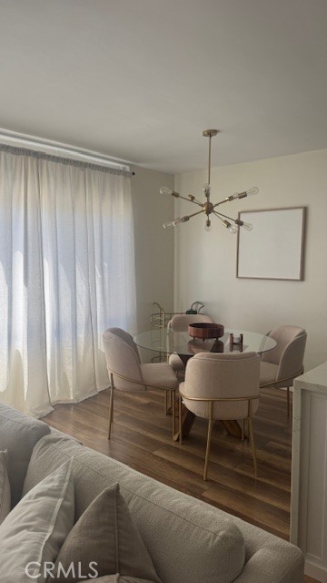 250 Linden, Unit 204 Signal Hill, CA 90802 - Photo 11 of 13 a dining room with furniture and a chandelier