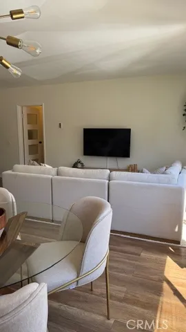 a living room with a couch and a flat screen tv