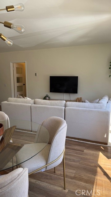 250 Linden, Unit 204 Signal Hill, CA 90802 - Photo 4 of 13 a living room with a couch and a flat screen tv