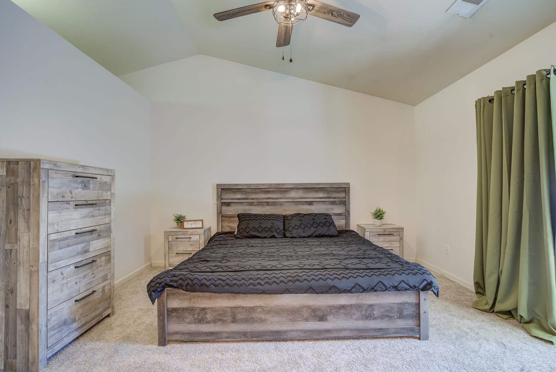 3343 Oak Street Anderson, CA 96007 - Photo 20 of 28 a bedroom with a bed and a chandelier fan