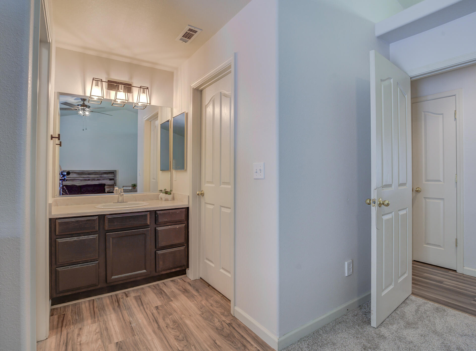 3343 Oak Street Anderson, CA 96007 - Photo 22 of 28 a spacious bathroom with a double vanity sink and a mirror
