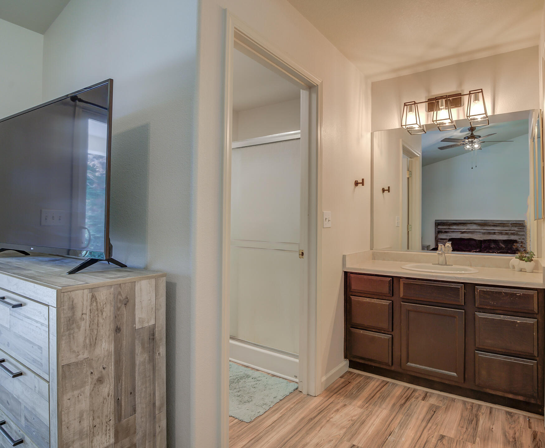 3343 Oak Street Anderson, CA 96007 - Photo 23 of 28 a kitchen with kitchen island granite countertop wooden cabinets and white appliances