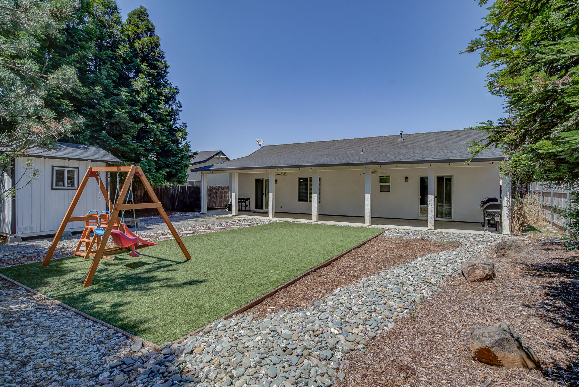 3343 Oak Street Anderson, CA 96007 - Photo 3 of 28 a view of a house with a backyard