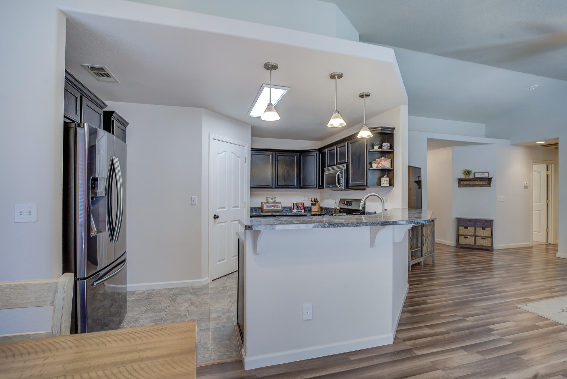 3343 Oak Street Anderson, CA 96007 - Photo 8 of 28 a kitchen with stainless steel appliances kitchen island granite countertop a refrigerator and a sink
