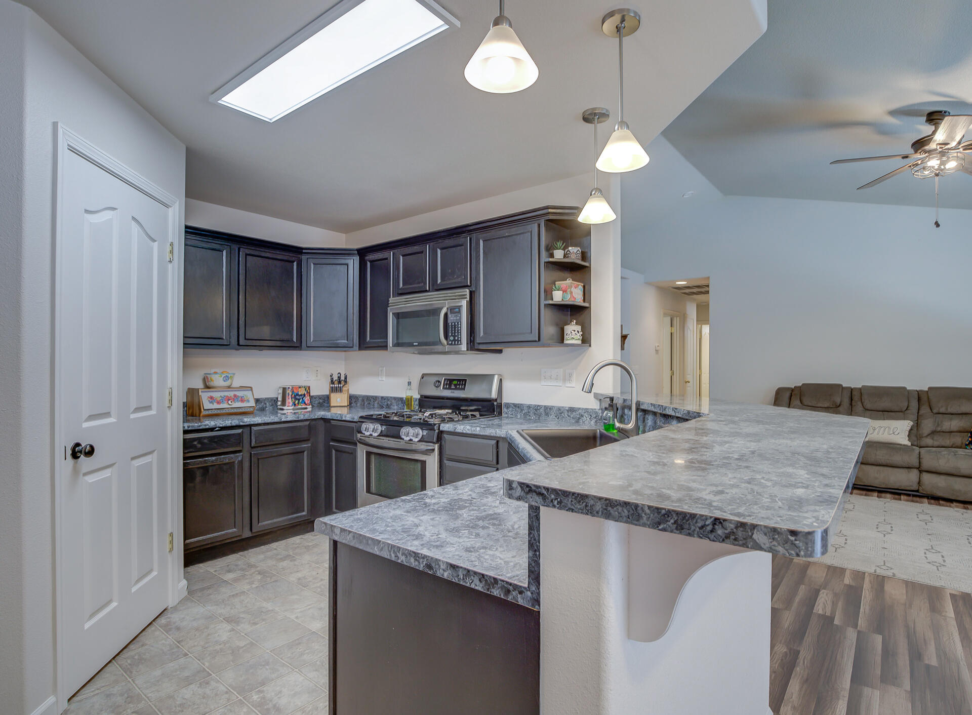 3343 Oak Street Anderson, CA 96007 - Photo 9 of 28 a kitchen with stainless steel appliances granite countertop a sink stove and refrigerator