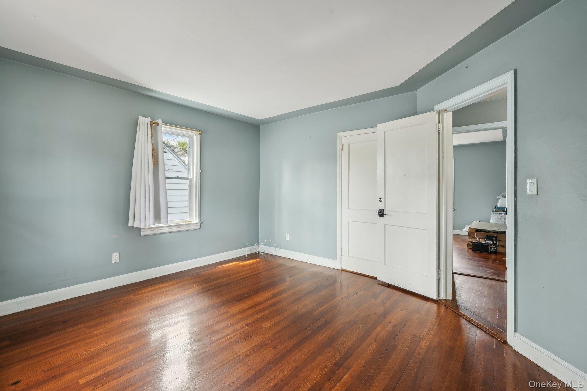 12 Highview Avenue Rye Brook, NY 10573 - Photo 12 of 19 Unfurnished bedroom with baseboards and wood finished floors