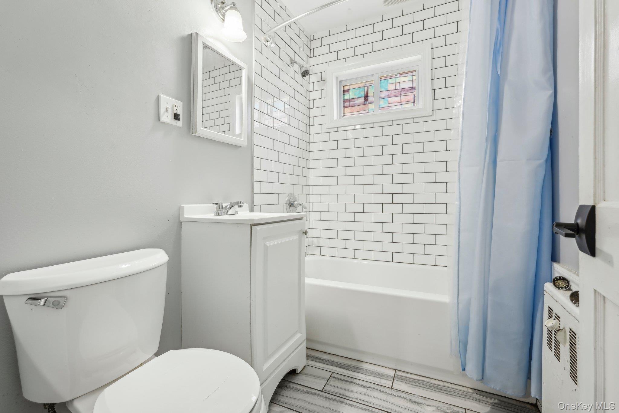 12 Highview Avenue Rye Brook, NY 10573 - Photo 13 of 19 Full bath featuring toilet, shower / bath combo with shower curtain, and vanity