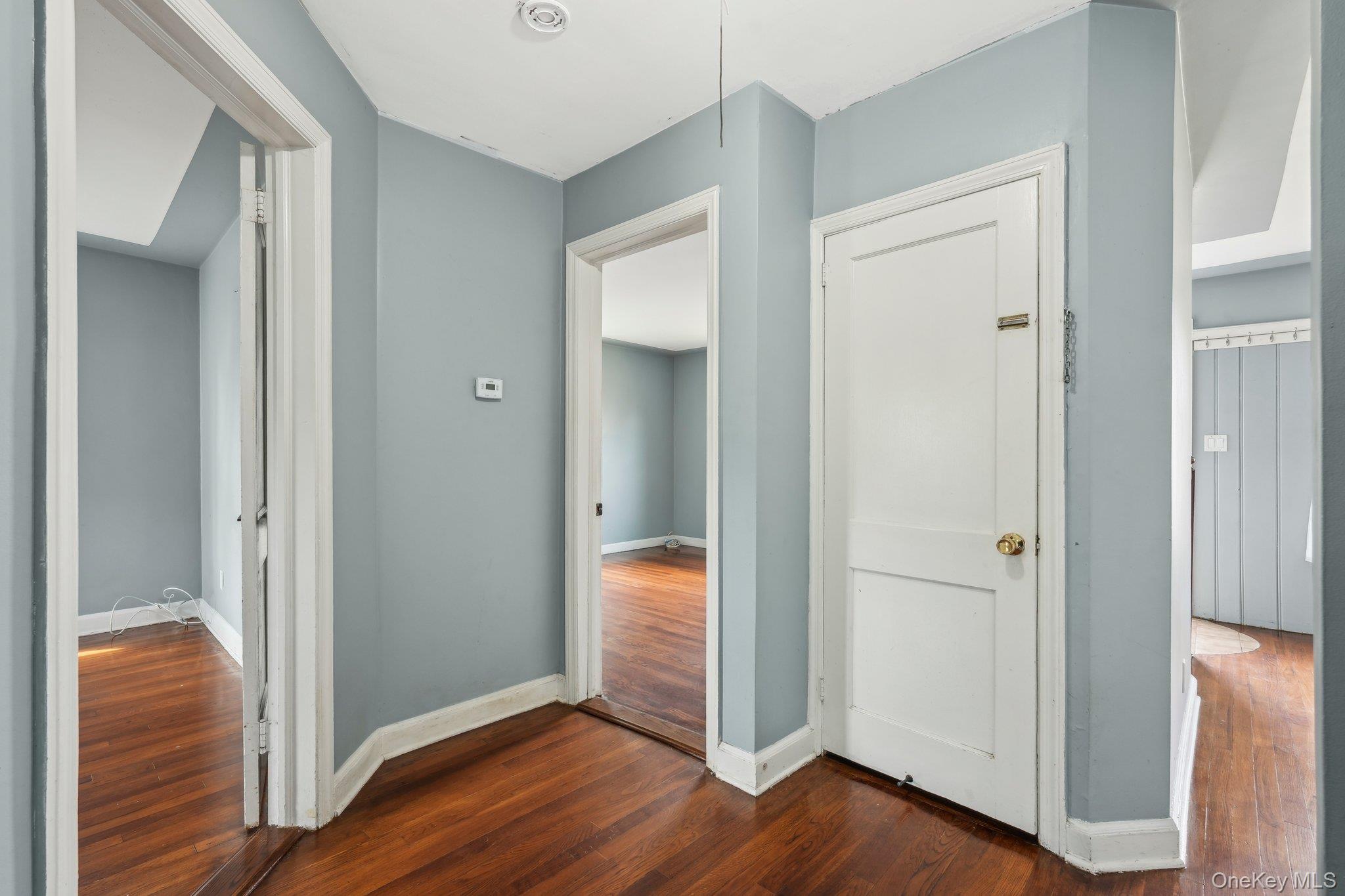 12 Highview Avenue Rye Brook, NY 10573 - Photo 9 of 19 Hallway featuring dark wood-type flooring and baseboards