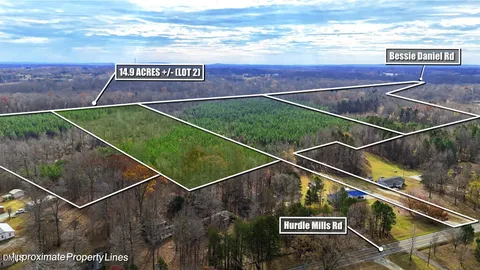a view of a backyard with table and chairs with wooden fence