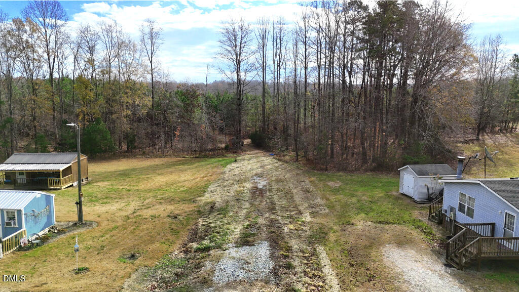 Lot 2 Hurdle Mills Road Roxboro, NC 27574 - Photo 5 of 12 a view of a backyard with table and chairs with wooden fence