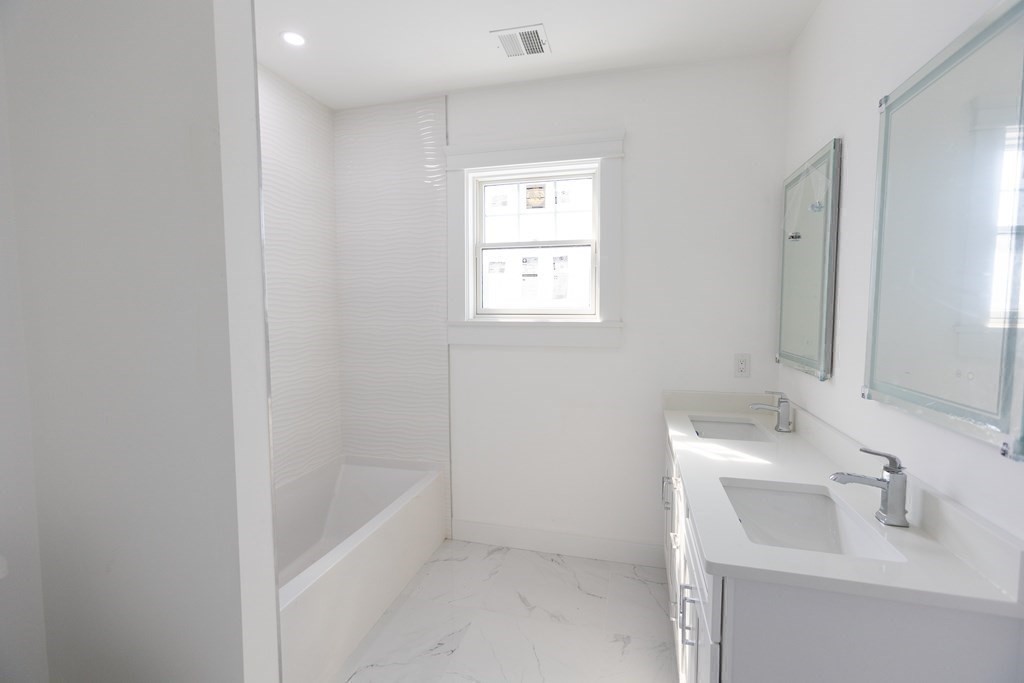 14 Lexington Road Wellesley, MA 02482 - Photo 14 of 19 a bathroom with a sink and a bathtub