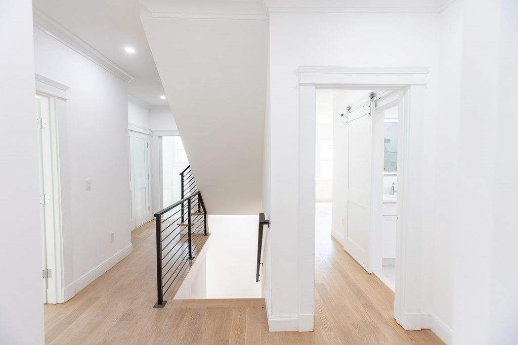 14 Lexington Road Wellesley, MA 02482 - Photo 15 of 19 a view of entryway with wooden floor
