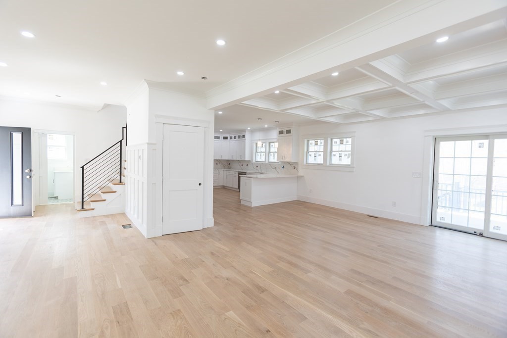 14 Lexington Road Wellesley, MA 02482 - Photo 4 of 19 a view of an empty room with wooden floor and a window