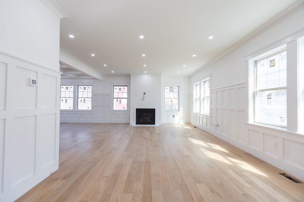14 Lexington Road Wellesley, MA 02482 - Photo 5 of 19 a view of an empty room with a window and fireplace