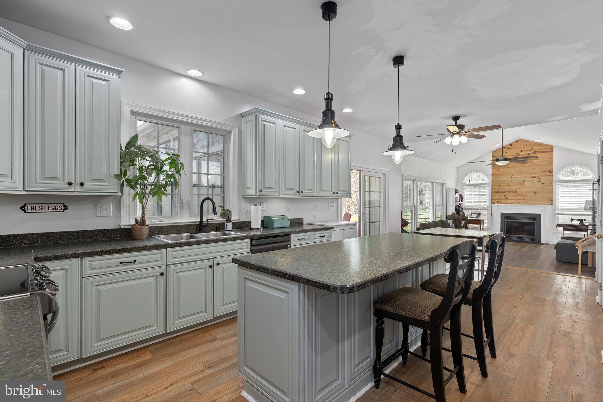 4525 Beckleysville Road Hampstead, MD 21074 - Photo 16 of 80 a kitchen with center island table and chairs in it