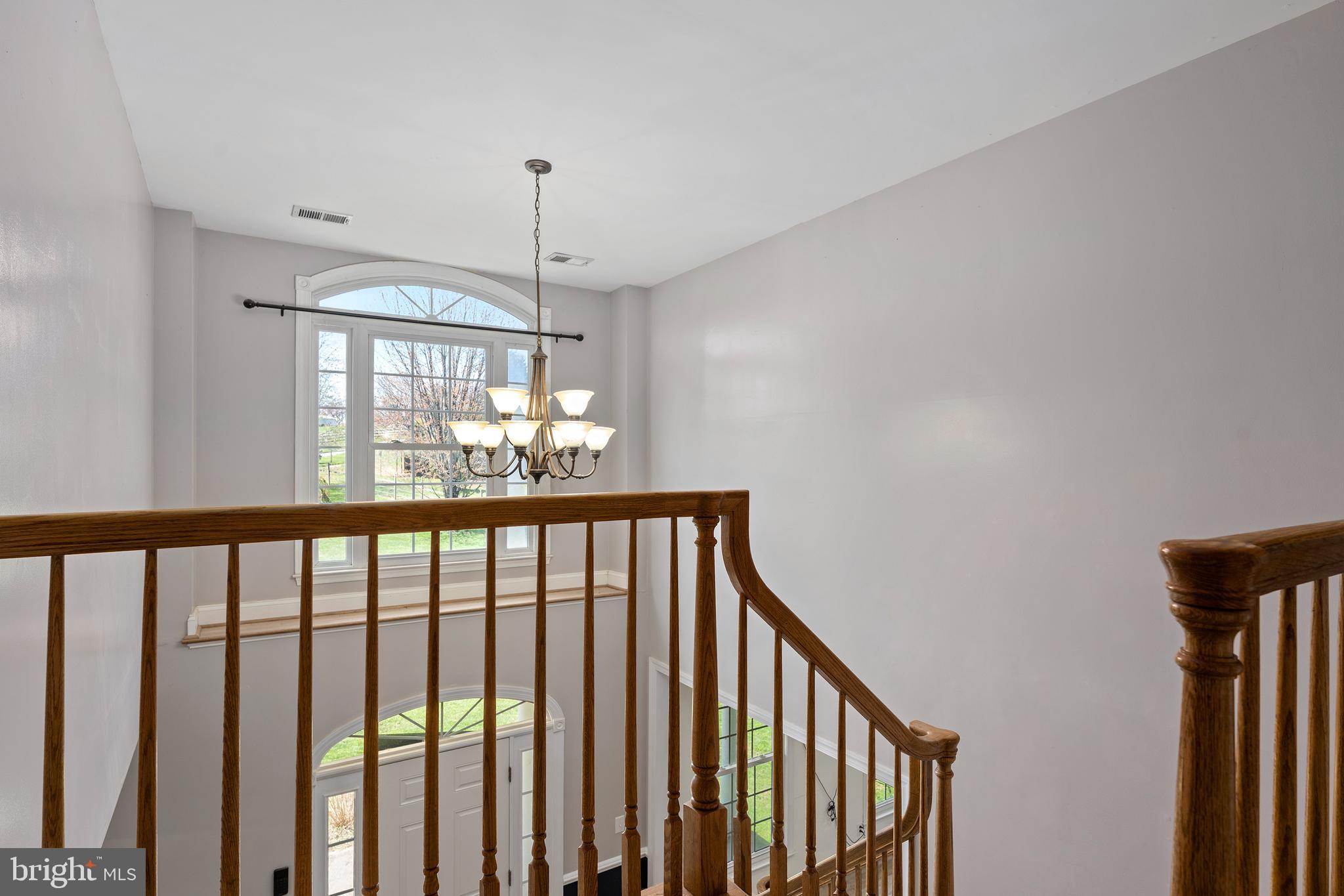 4525 Beckleysville Road Hampstead, MD 21074 - Photo 30 of 80 a view of staircase with railing and chandelier