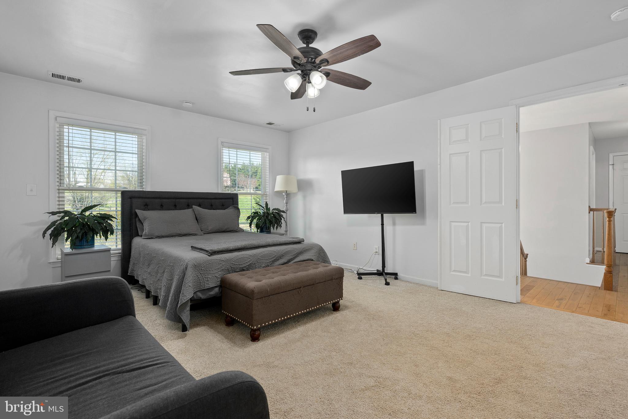 4525 Beckleysville Road Hampstead, MD 21074 - Photo 32 of 80 a bedroom with a bed and a flat screen tv