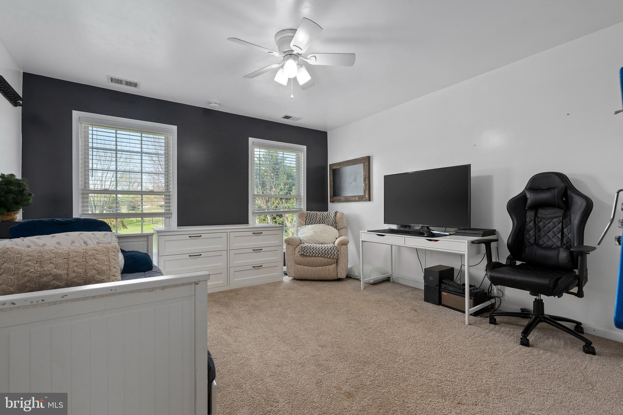4525 Beckleysville Road Hampstead, MD 21074 - Photo 42 of 80 a living room with furniture and a flat screen tv