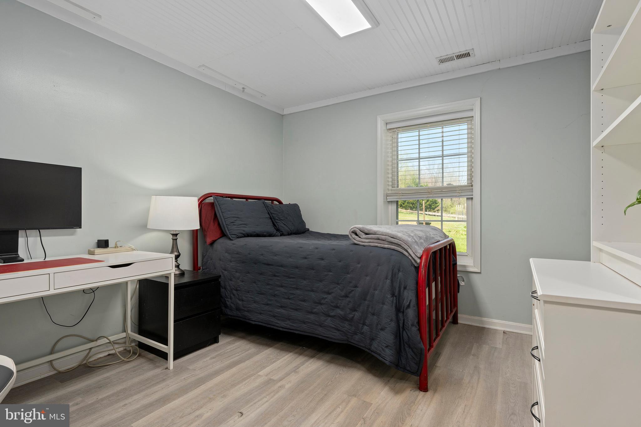 4525 Beckleysville Road Hampstead, MD 21074 - Photo 46 of 80 a bedroom with a bed and a flat screen tv