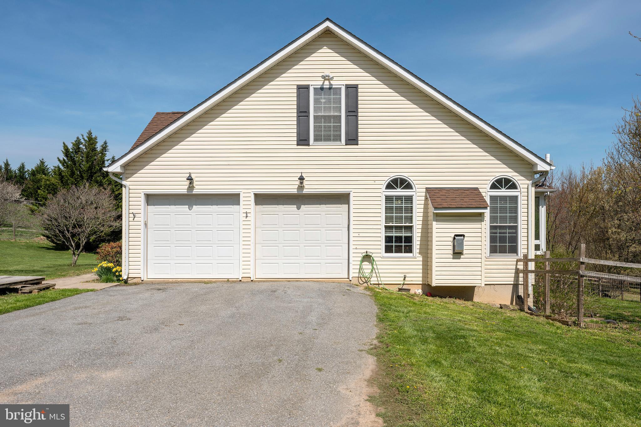 4525 Beckleysville Road Hampstead, MD 21074 - Photo 56 of 80 a front view of a house with a yard and garage