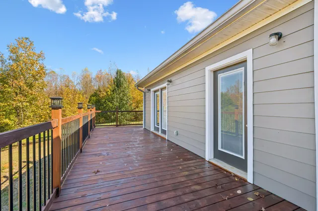 a room with wooden floor and a flat screen tv