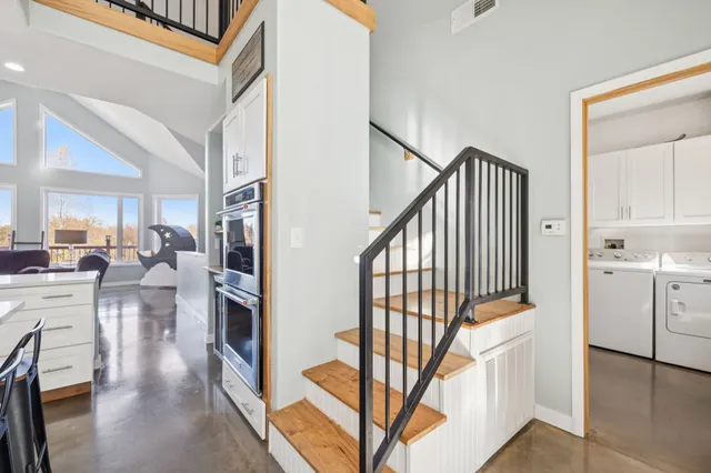 a room with wooden floor and a flat screen tv