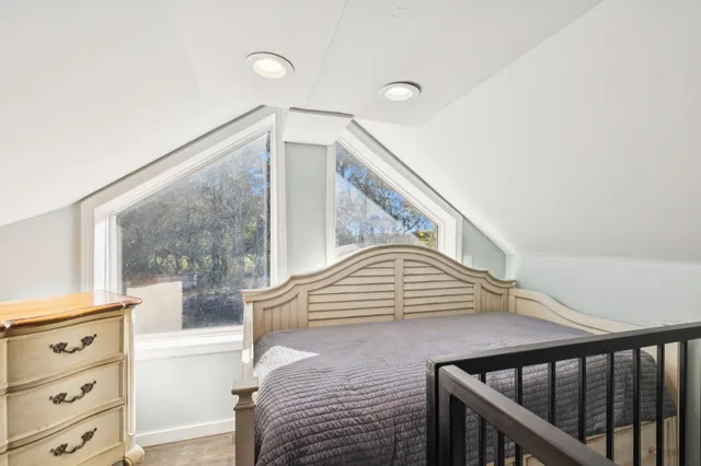 a view of a field with trees around