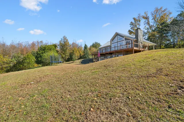 a view of a porch with wooden floor and fence