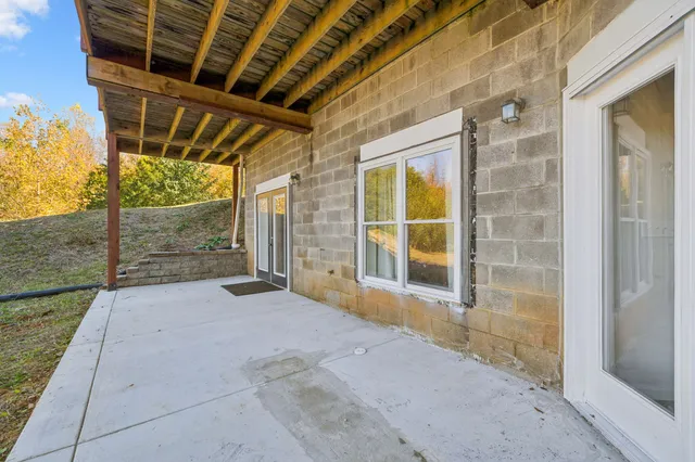 a view of living room with furniture and wooden floor