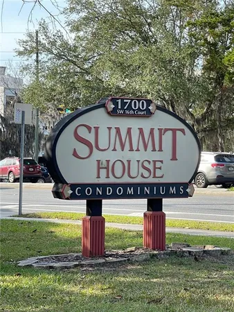 a view of outdoor space with sign board and yard