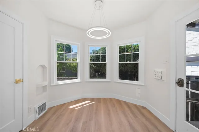 a view of an empty room with a window
