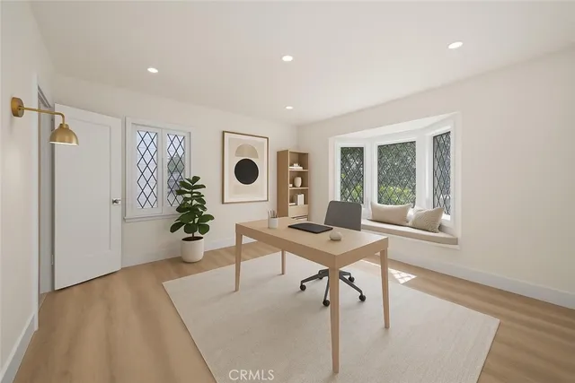 a workspace with furniture and window