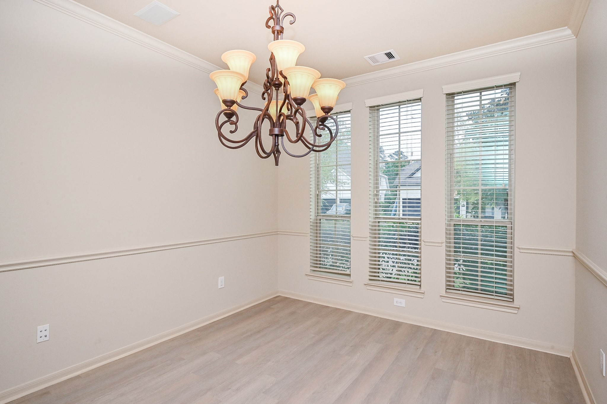 19 Sandwell Place Spring, TX 77389 - Photo 6 of 33 Elegant dining room with chandelier and plenty of natural light