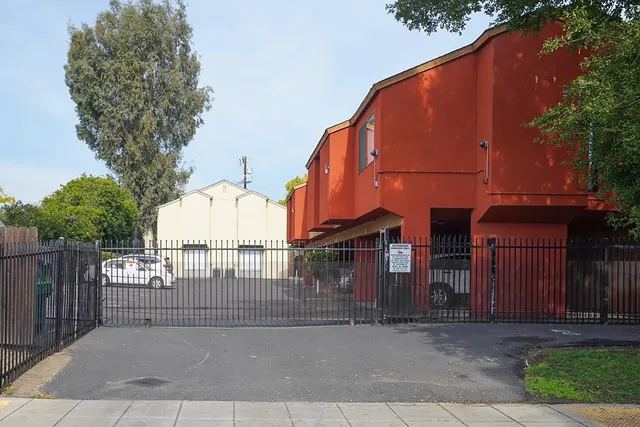 a view of a large building next to a yard
