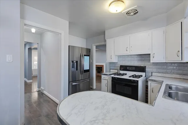 a bathroom with a sink toilet and a mirror