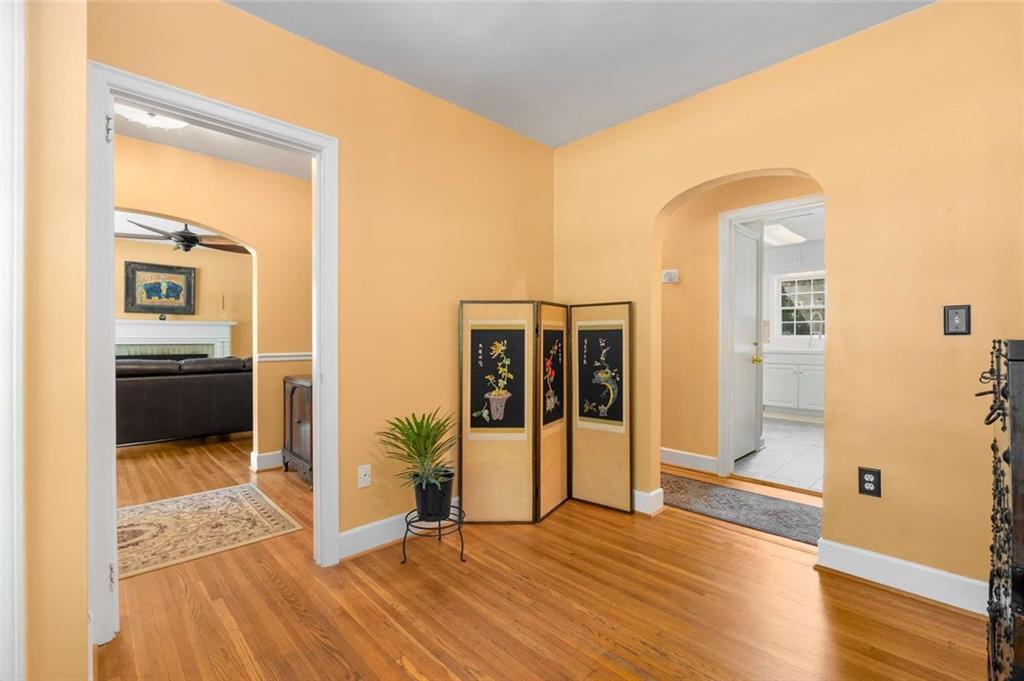 601 Ridgewood Avenue Gainesville, GA 30501 - Photo 11 of 36 a view of a hallway with wooden floor and a living room