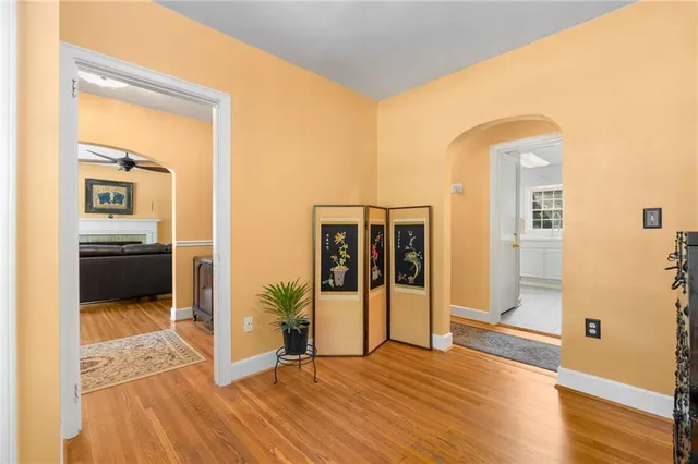 a living room with furniture and large windows