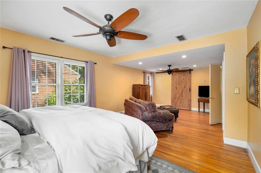 601 Ridgewood Avenue Gainesville, GA 30501 - Photo 14 of 36 a spacious bedroom with a bed and a large window