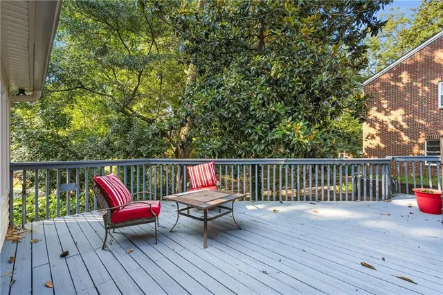 a bathroom with a bathtub shower sink and mirror