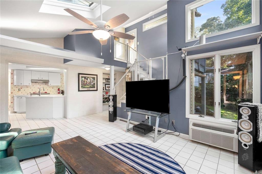 601 Ridgewood Avenue Gainesville, GA 30501 - Photo 17 of 36 a living room with furniture and a flat screen tv