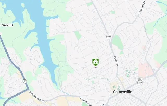 a spacious bedroom with a bed and a large window