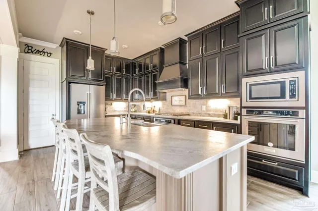 a bedroom with a bed and flat screen tv