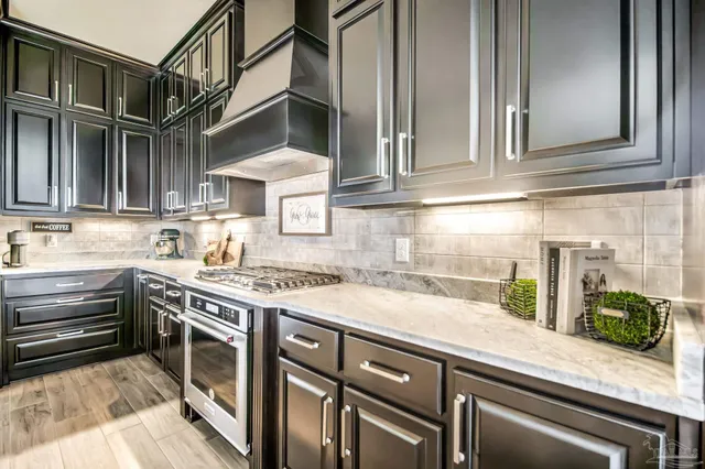 a white bath tub sitting in a bathroom next to a window