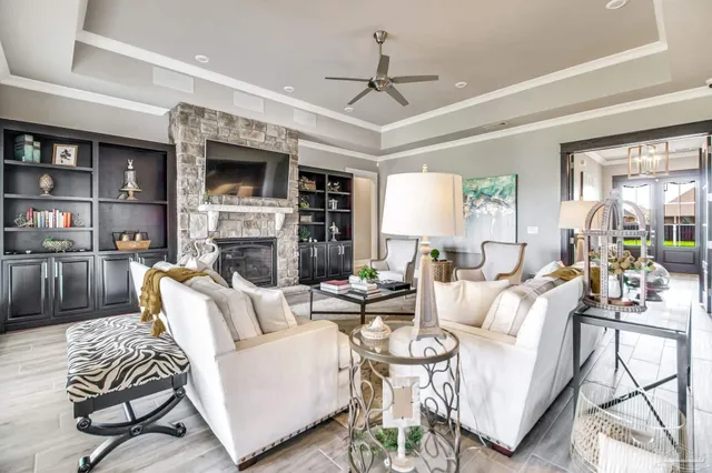 a bedroom with a large bed and a flat tv screen on dresser