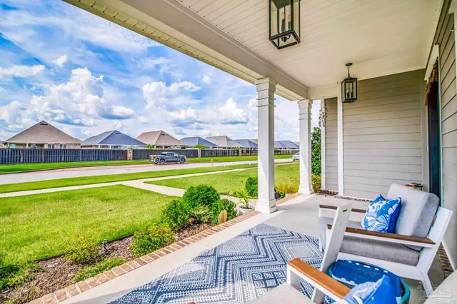 a view of a kitchen with kitchen island a sink and living room view