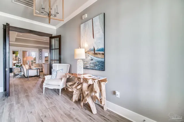 a dining room with furniture a window and a chandelier